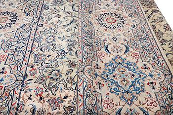 A Nain carpet, part silk, 9 laa, c. 453 x 298 cm.