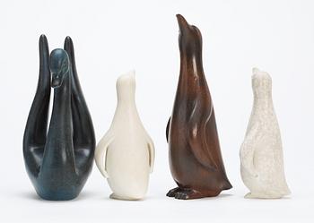 Four Gunnar Nylund stoneware figures, a swan and three penguins, Rörstrand.