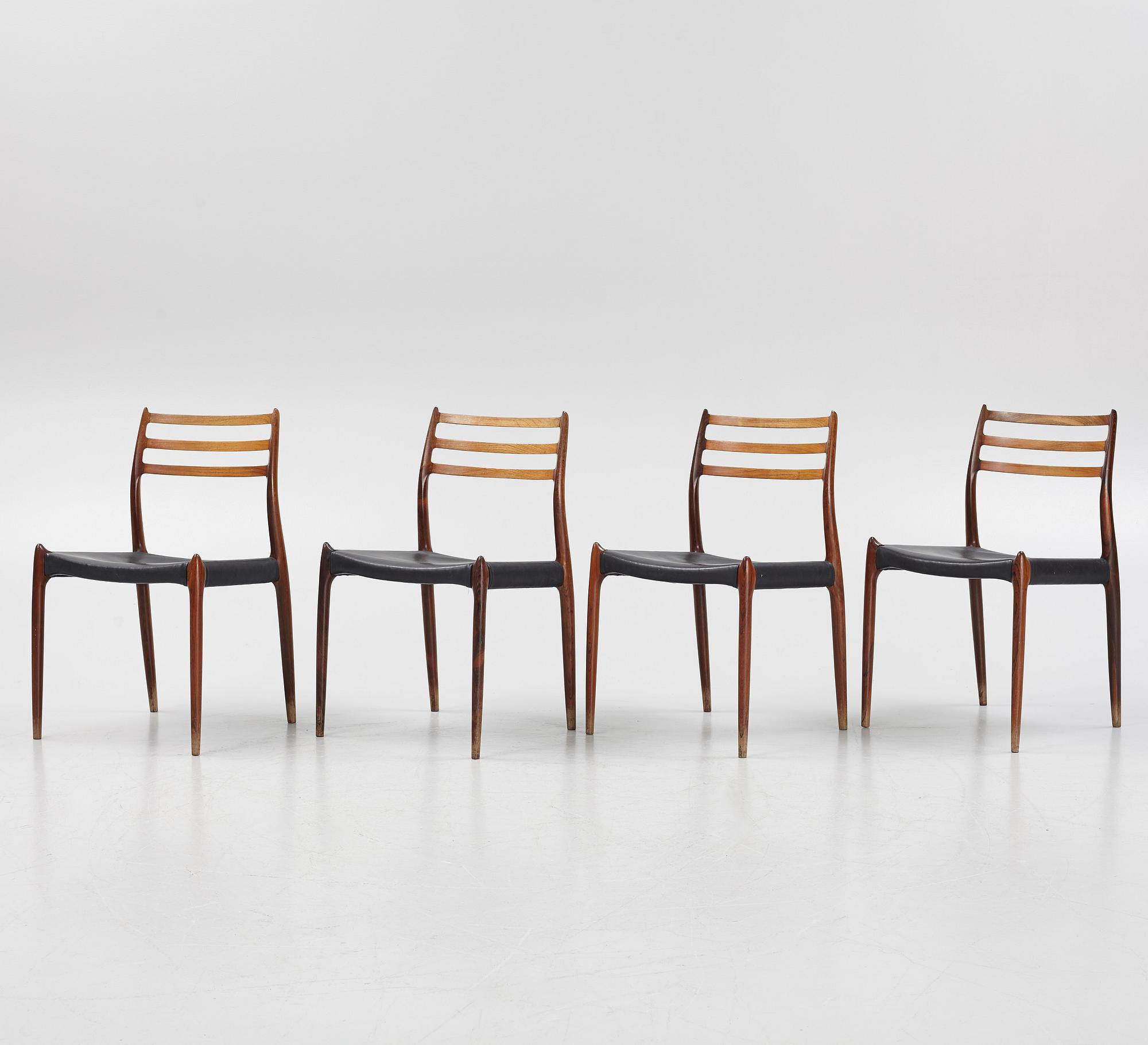 Niles Otto Møller, a rosewood veneered table with four chairs, JL Møller, Denmark, 1950's/60's.