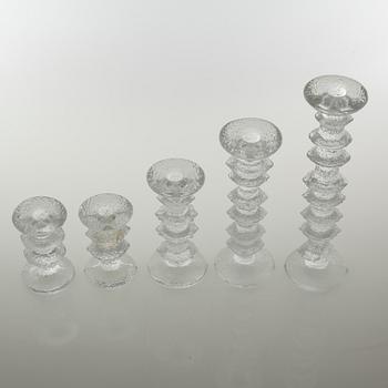 Five glass candlesticks by Timo Sarpaneva for Iittala, model "Festivo", second half of the 20th century.