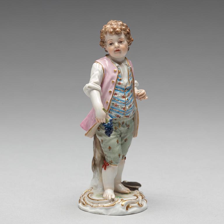 A Meissen figure of a young boy with grapes, 1890's.