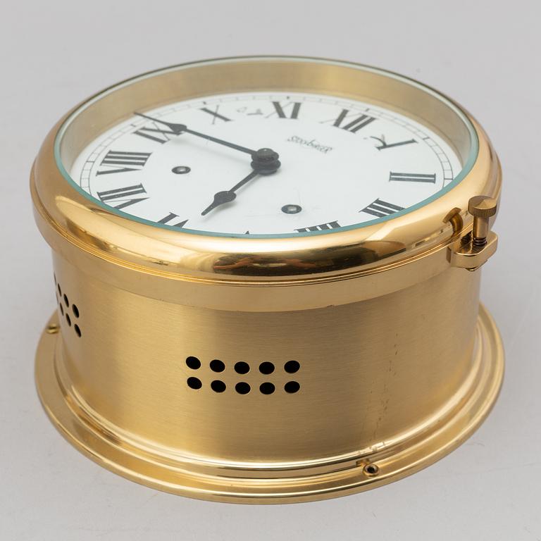 A BRASS MARINE CLOCK AND BAROMETER BY STOCKBURGER.