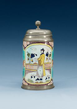 1396. A German faience pewter-mounted tankard, 18th Century.