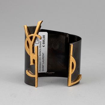 YVES SAINT LAURENT, a metal bangle.