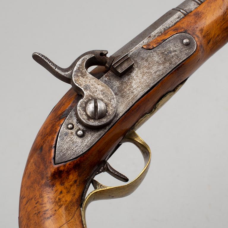 Two Swedish percussion pistols with birch stocks and brass mounts.