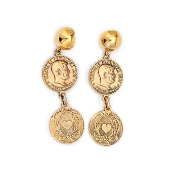 MOSCHINO cheap and chic, a pair of gold colored clip earrings.