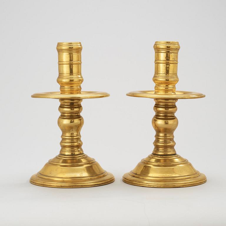 A pair of presumably Dutch colonial candlesticks.