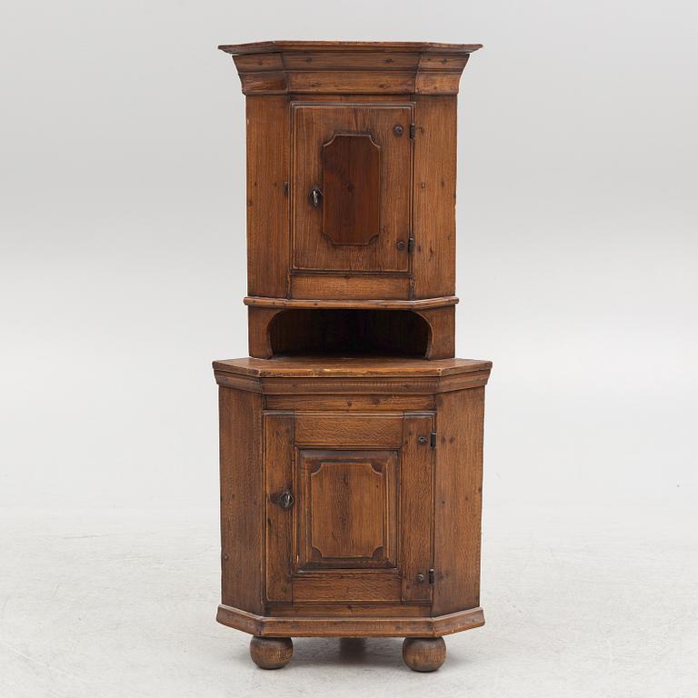 A provincial corner cabinet, early 19th century.