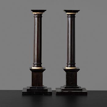 92. A pair of Empire early 19th century candlesticks.