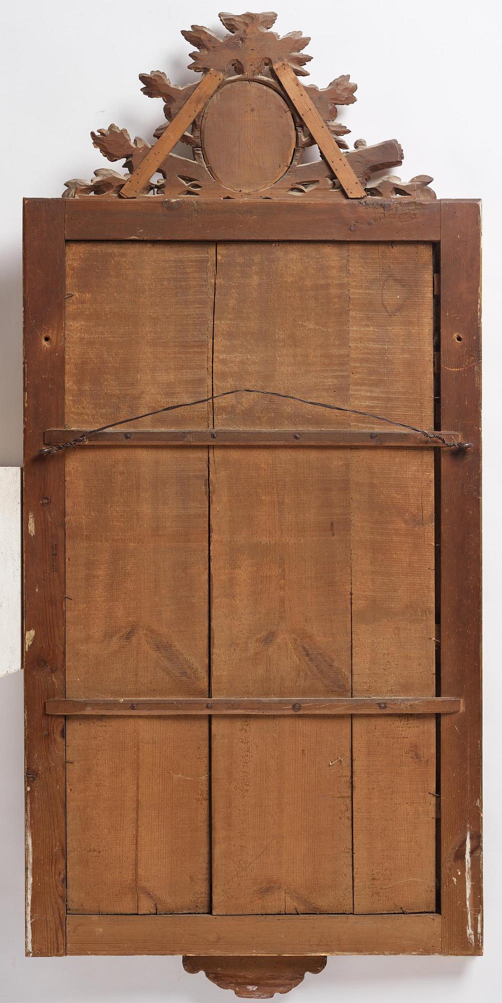 A late-Gustavian carved giltwood mirror by C. Corssar (master in Stockholm 1791-1808).