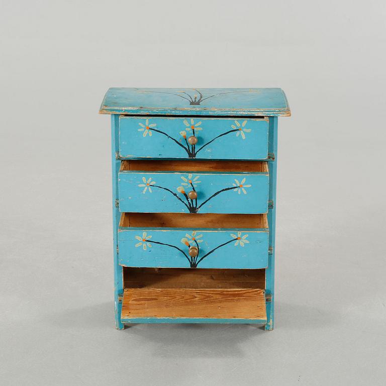 A children's chest of drawers, dated 1937.