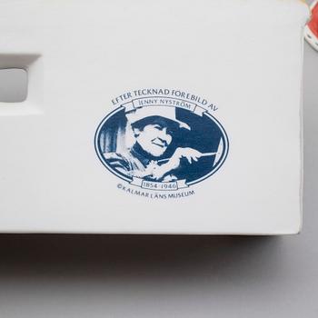 JULKRUBBA, 15 delar, porslin, efter Jenny Nyström, Kalmar Länsmuseum.