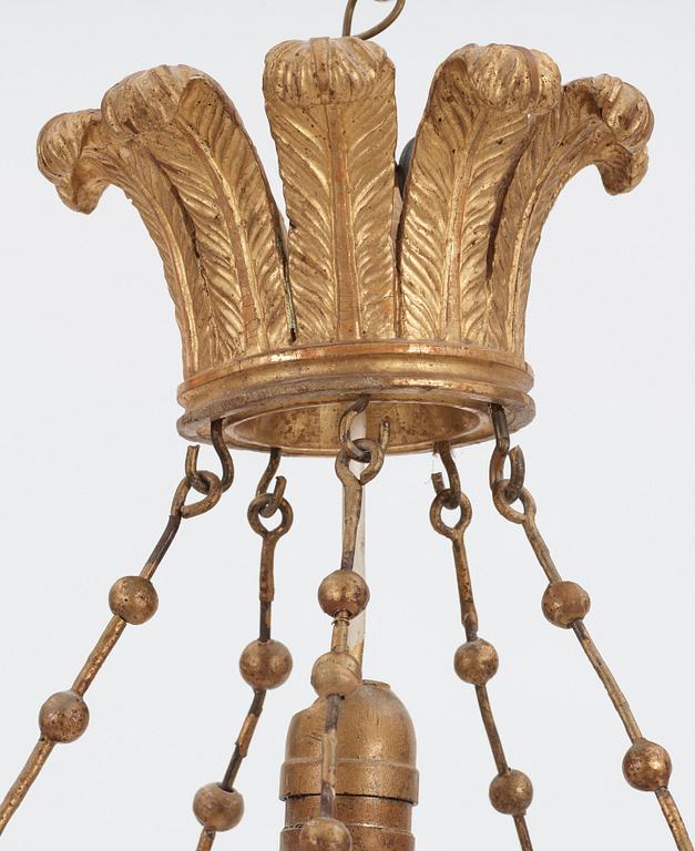 A German Empire 19th century ten-light gilt wood hanging lamp, possibly after K. F. Schinkel.