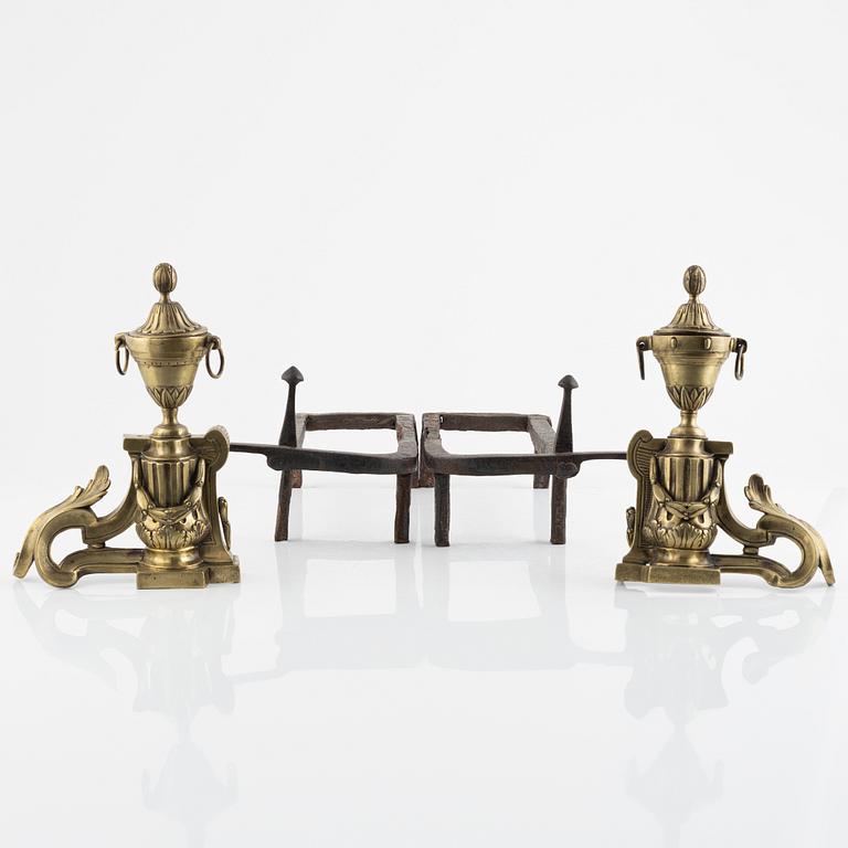 A pair of bronze andirons, Louis XVI-style, around 1800.