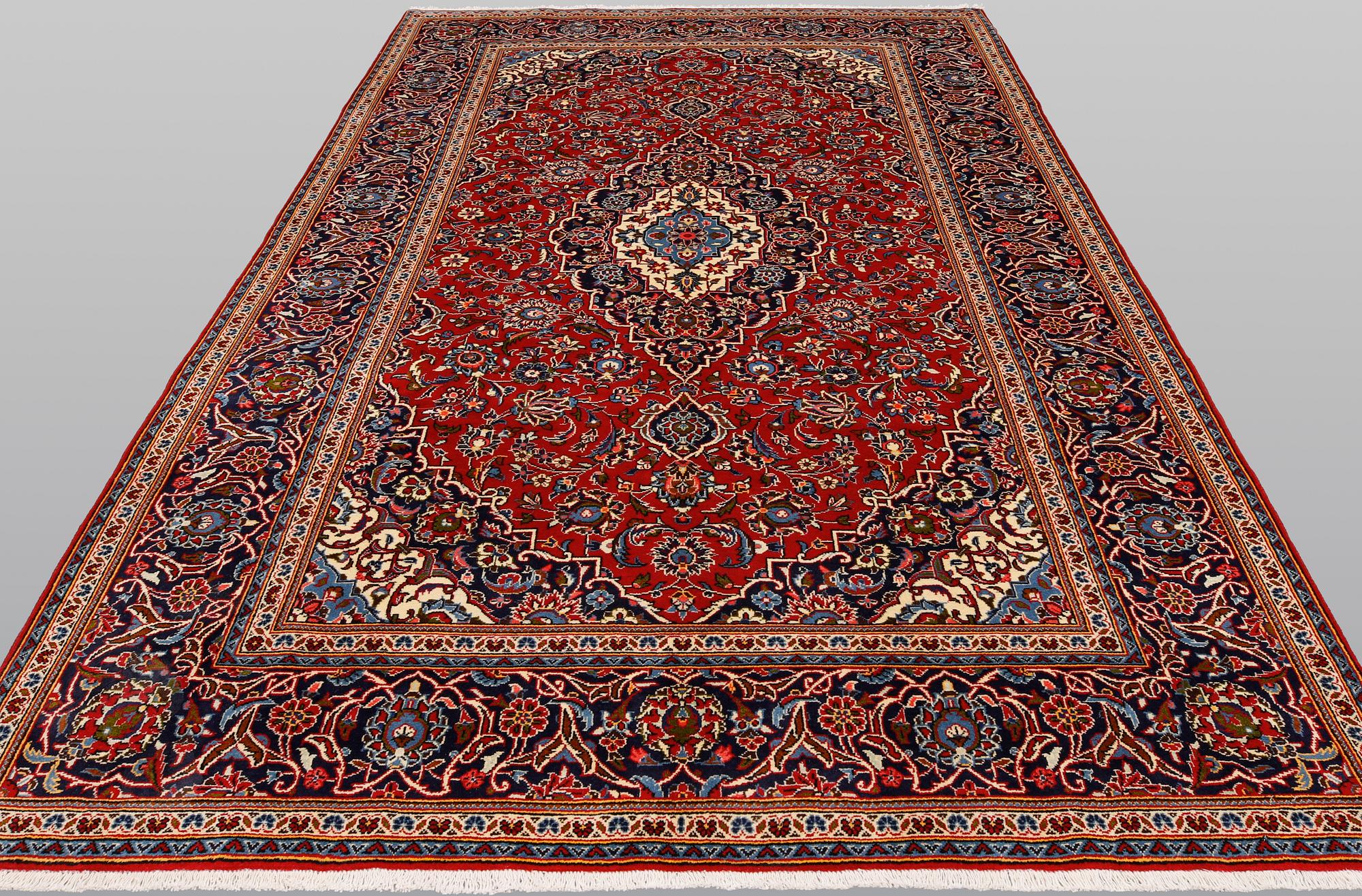 A Keshan rug, approx. 307 x 195 cm.