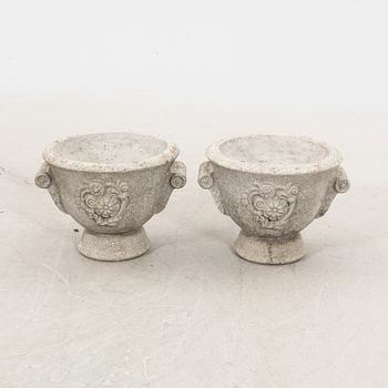 A pair of concrete garden urns 20th century.