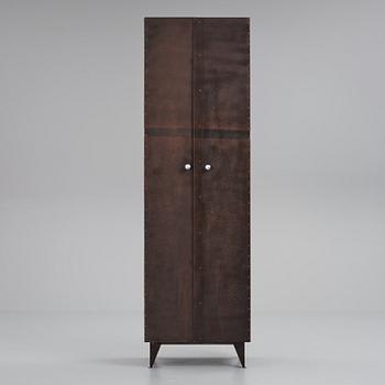 A contemporary patinated metal cabinet.