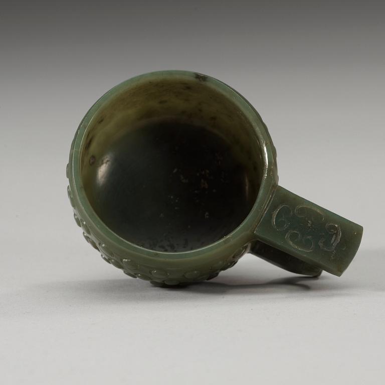 A Chinese archaistic carved nephrite cup.