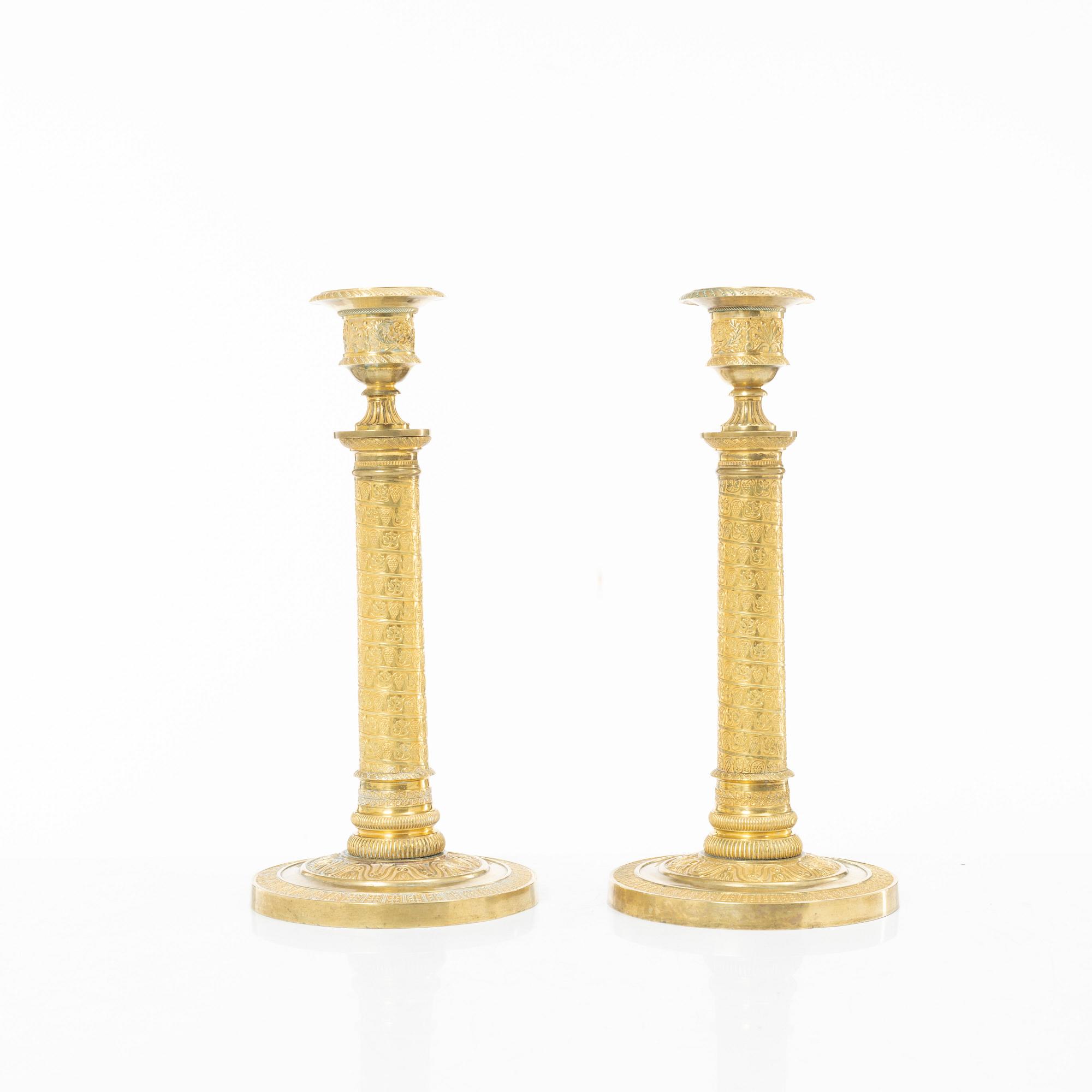 A pair of Empire candlesticks, France, early 19th Century.
