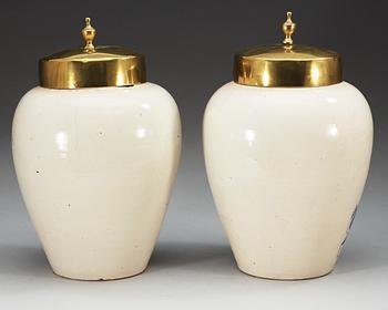 A pair of Dutch fainece tobacco jars, 18th Century.