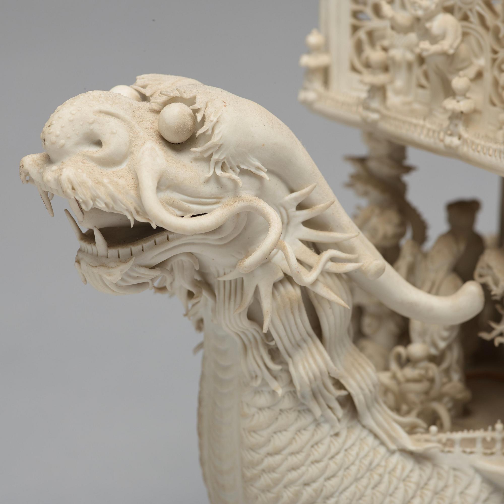 A biscuit porcelain dragon boat of 'Assembly of Immortals', Qing dynasty, Daoguang, signed Chen Guozhi, 19th century.