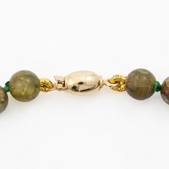 18K gold bracelet with peridot beads, Italy.
