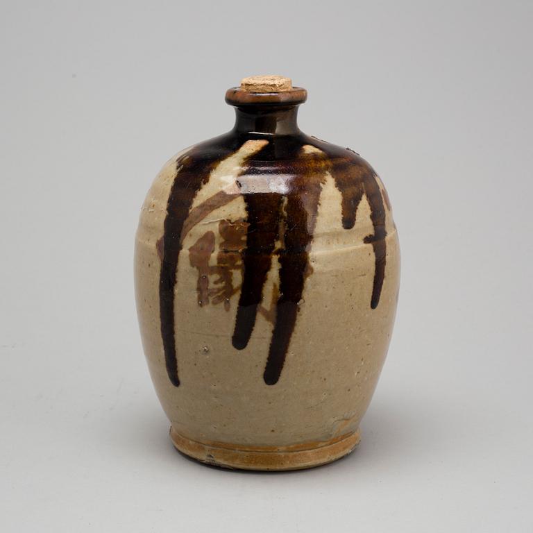 A Japanese glazed ceramic 'tokkari' sake bottle, presumably 18th century.