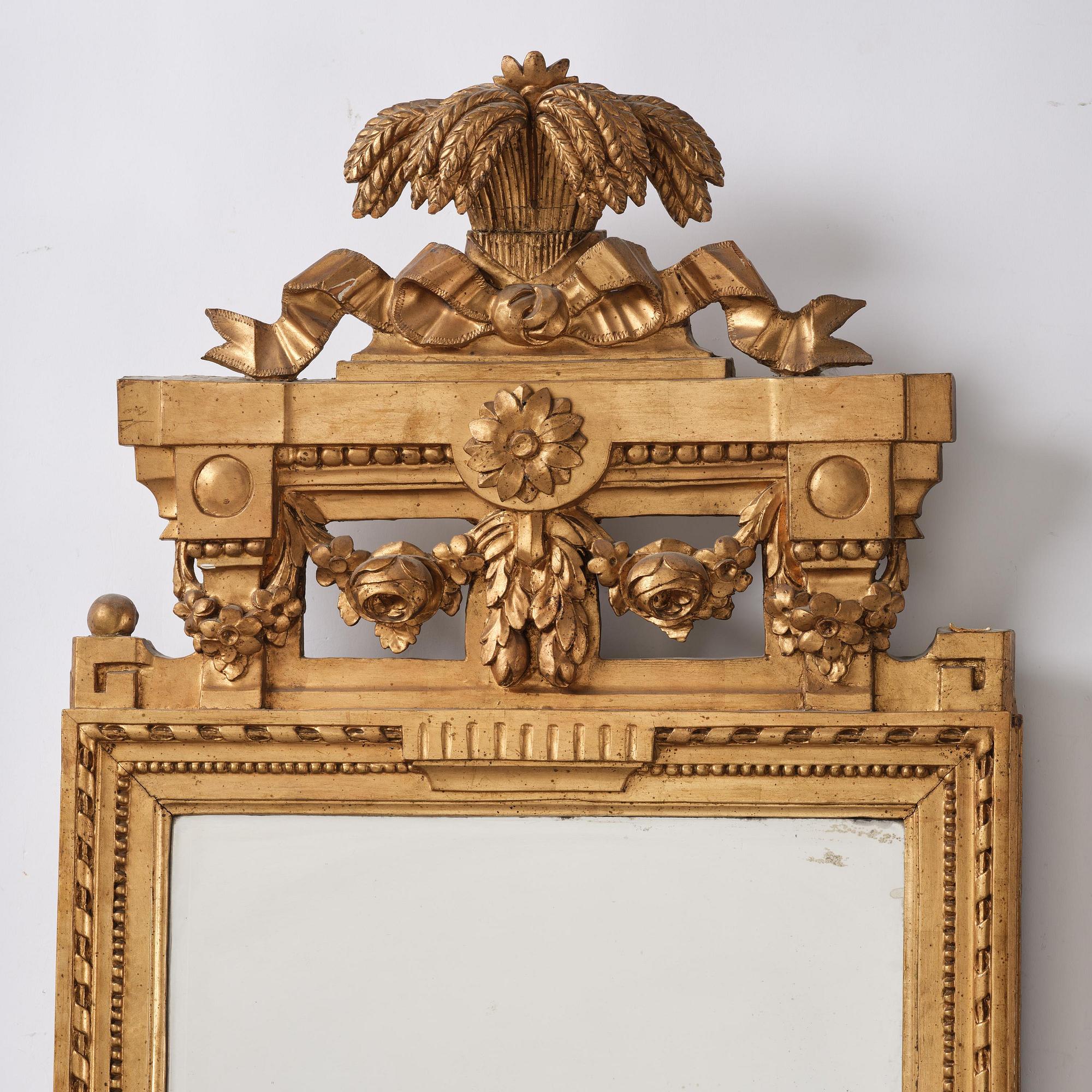 A Gustavian Giltwood mirror by J. Åkerblad and A. Öberg, Stockholm, 1780's.