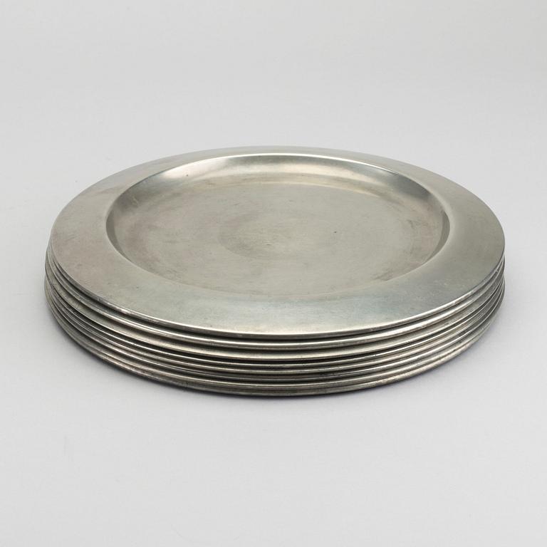 FIRMA SVENSKT TENN, A set of eight 1960s pewter plates by Firma Svenskt Tenn.