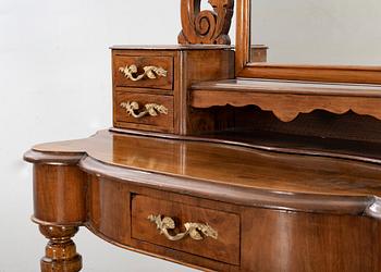 A second half of the 19th century table with mirror and a stool.