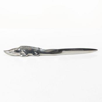 Firma Svenskt Tenn, Candelabrum, 'Vänskapsknuten', and paper knife, 'Alligator'.