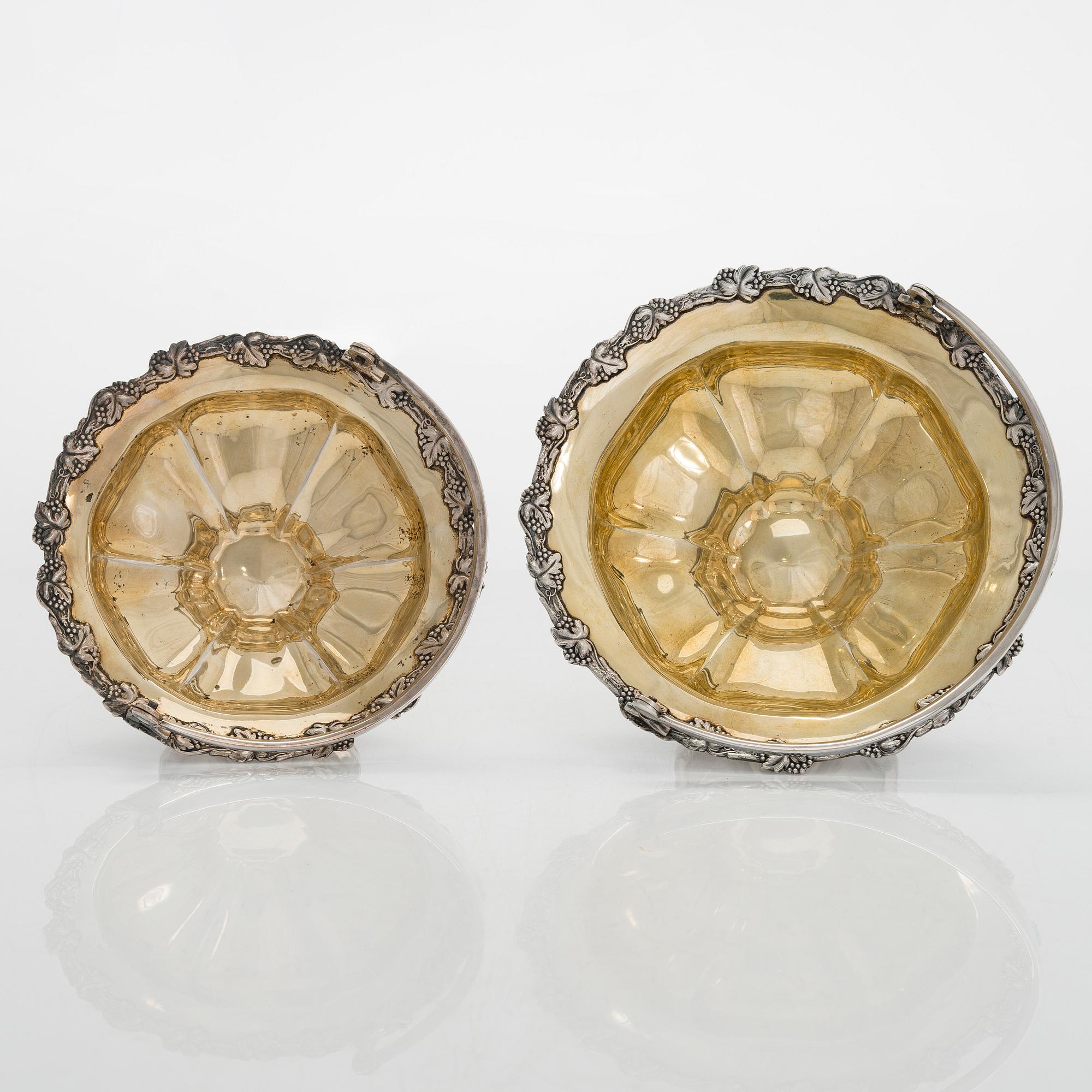 A set of two 1920s-1930s silver sweetmeat basket with sugar tong and jam spoon, Uusi Kultaseppä Oy, Helsinki, Finland.