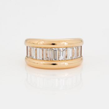 A HALF-ETERNITY RING set with baguette-cut diamonds.