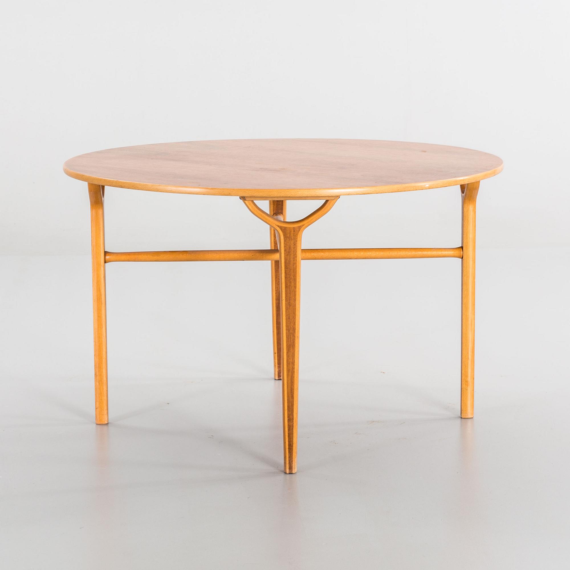AN AX COFFE TABLE BY HVIDT & MOLGAARD.