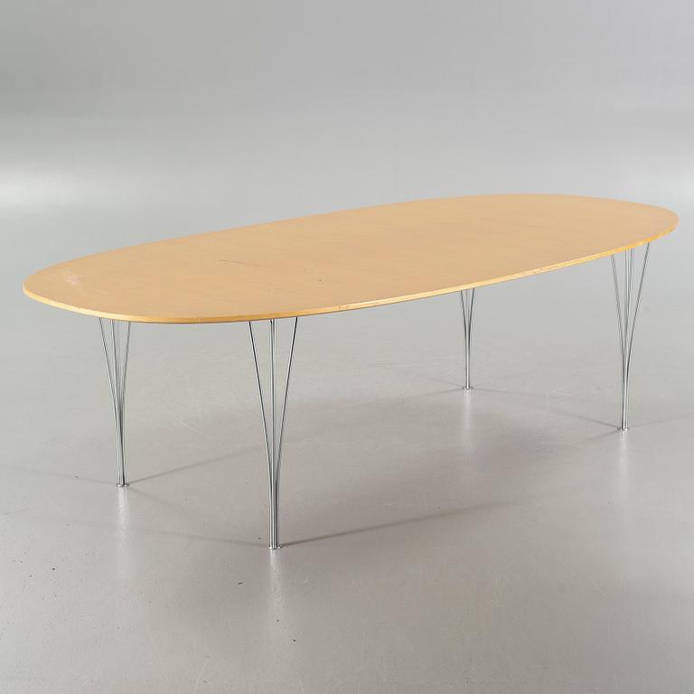 A "Superellips" table by BRUNO MATHSSON and PIET HEIN made by Fritz Hansen in 1980.