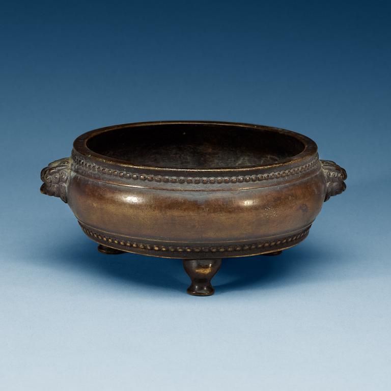 A bronze tripod censer, Qing dynasty (1644-1912), with Xuande six character mark.