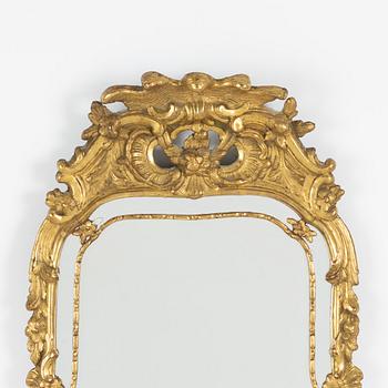 A Rococo style mirror, late 19th Century.