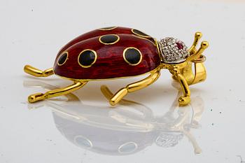 PENSANT 18k gold, brilliant-cut diamonds, 2 rubies and enamel, approx 4 x 3 cm.