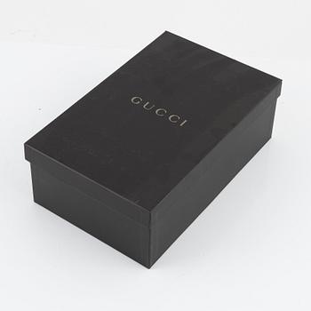 Gucci, a pair of black leather and pony hair shoes, Italian size 36.