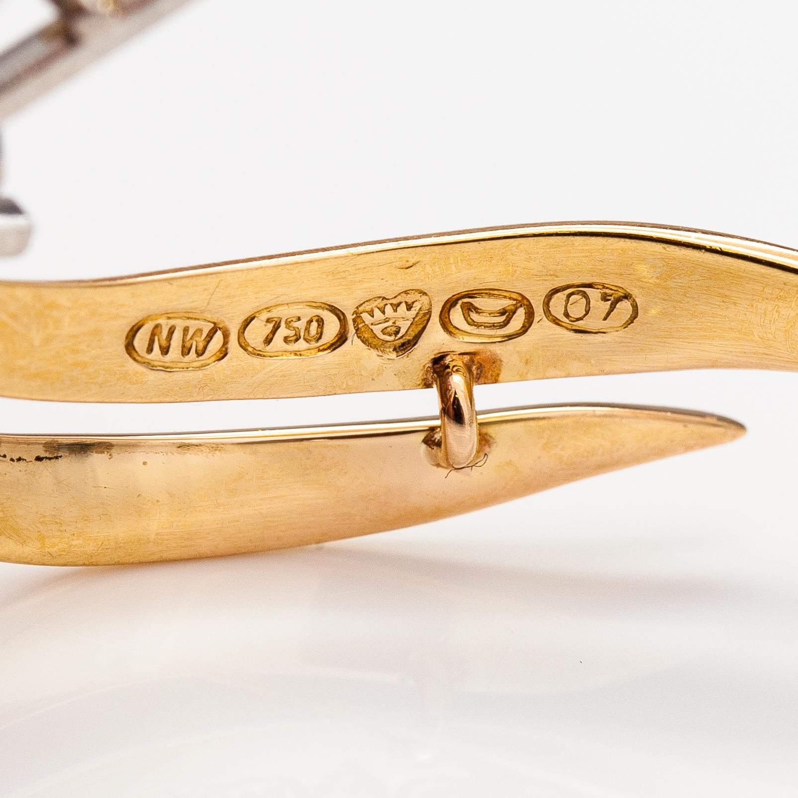 An 18K gold brooch with cultured pearls and ca. 0.30 ct diamonds. Westerback, Helsinki 1967.