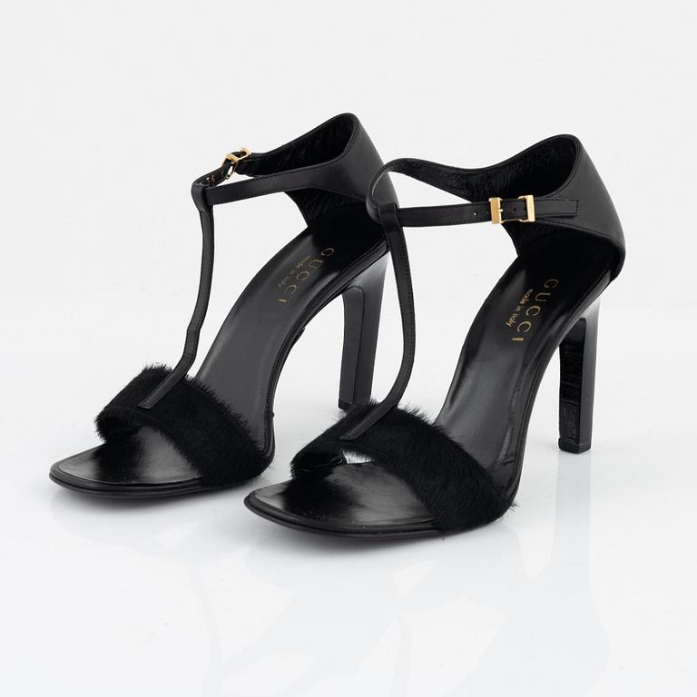 Gucci, a pair of black leather and pony hair shoes, Italian size 36.