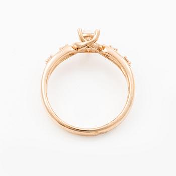 Ring 14K rose gold with a pear-shaped diamond and brilliant-cut diamonds, accompanied by an IGI report.