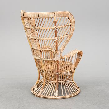 GIO PONTI & LIO CARMINATI, A 'Conte Biancamano' rattan Wingback Armchair for Bonacina, Italy.