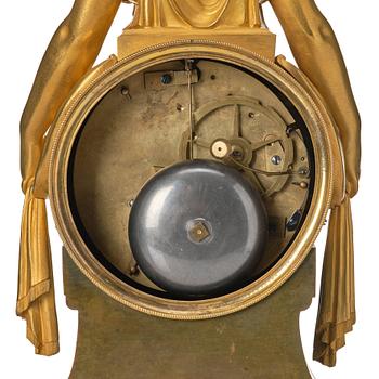 An Empire bronze mantle clock.