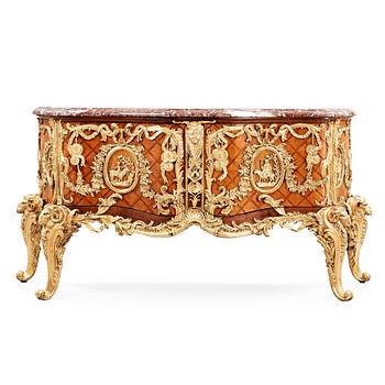 1174. A Louis XV-style commode after Antoine Gaudreaux, first half 20th century.