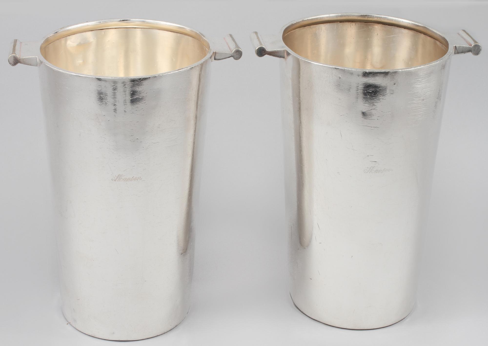 RIESLINGSKYLARE/CHAMPAGNEKYLARE, ett par, så kallat restaurangsilver, Skansens Hotell, 1900-tal.