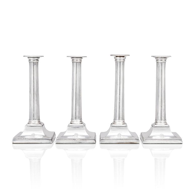 Four English 18th century silver candlesticks, mark of Young, Greaves & Hoyland, Sheffield 1780.