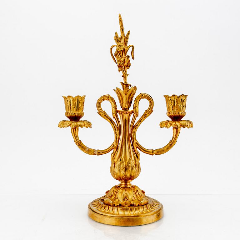 A pair of Louis XV-style bronze candelabras.