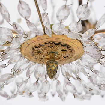 A late-Gustavian five-light gilt brass and cut glass chandelier, Stockholm, circa 1800.