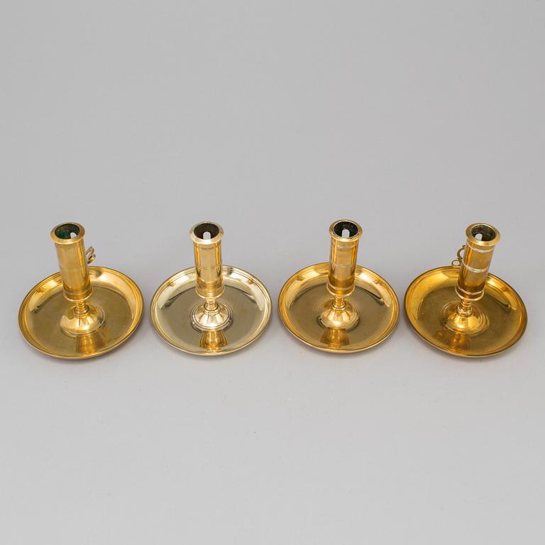 Four brass candlesticks from Skultuna and Svenska Metallverken, second half of the 20th Century.